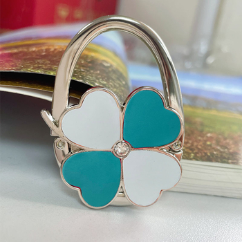 Loominguline õnneliku rohuga kokkupandav kotikonks, kaasaskantav neljaleheline ristik puhtast nahast laua küljeriputi naiste käekotikoti konks