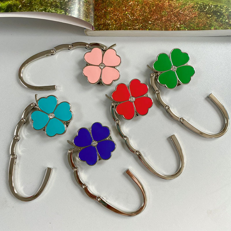 Loominguline õnneliku rohuga kokkupandav kotikonks, kaasaskantav neljaleheline ristik puhtast nahast laua küljeriputi naiste käekotikoti konks