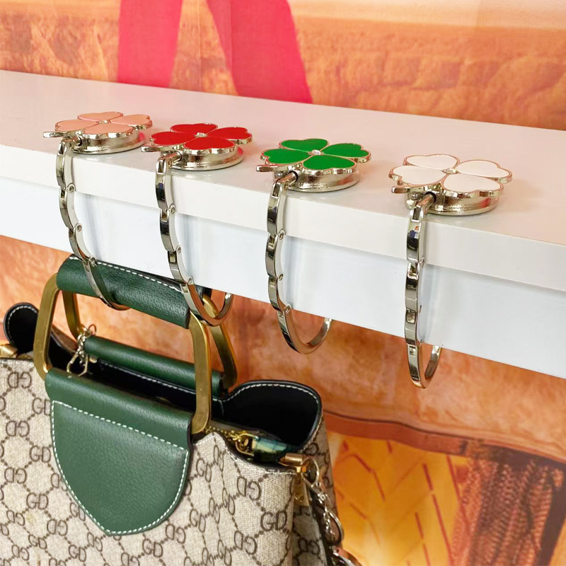 Loominguline õnneliku rohuga kokkupandav kotikonks, kaasaskantav neljaleheline ristik puhtast nahast laua küljeriputi naiste käekotikoti konks