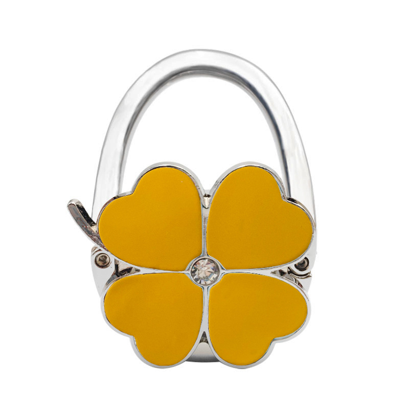 Loominguline õnneliku rohuga kokkupandav kotikonks, kaasaskantav neljaleheline ristik puhtast nahast laua küljeriputi naiste käekotikoti konks