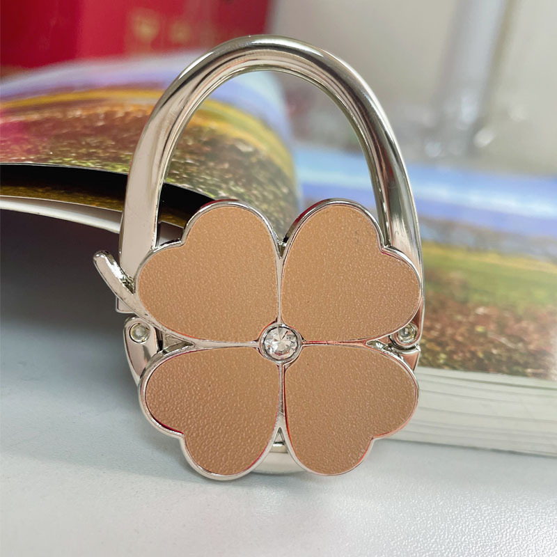 Loominguline õnneliku rohuga kokkupandav kotikonks, kaasaskantav neljaleheline ristik puhtast nahast laua küljeriputi naiste käekotikoti konks