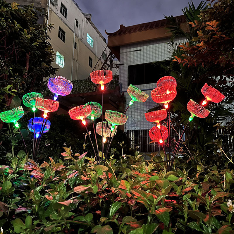 Napelemes gyeplámpa gradientes optikai rostos medúza effektussal, földre szerelhető tartóval, IP65, 0,05W, 12–16 órás üzemidő, CE tanúsítvány, testreszabás elérhető