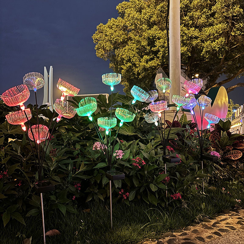 Napelemes gyeplámpa gradientes optikai rostos medúza effektussal, földre szerelhető tartóval, IP65, 0,05W, 12–16 órás üzemidő, CE tanúsítvány, testreszabás elérhető