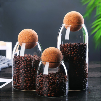 Stiklo laikymo indas su kamštiniu dangteliu, apvalios formos, iš borosilikatinio stiklo, teai ir kavos pupelėms