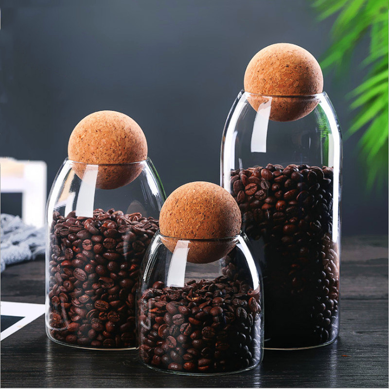 Stiklo laikymo indas su kamštiniu dangteliu, apvalios formos, iš borosilikatinio stiklo, teai ir kavos pupelėms