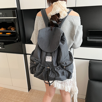 Ruksak velike kapacitete u urbanom minimalističkom stilu, korejski karirani uzorak, zatvarač na vrpce, laminirana unutarnja džep sa zipom, poliester podstava