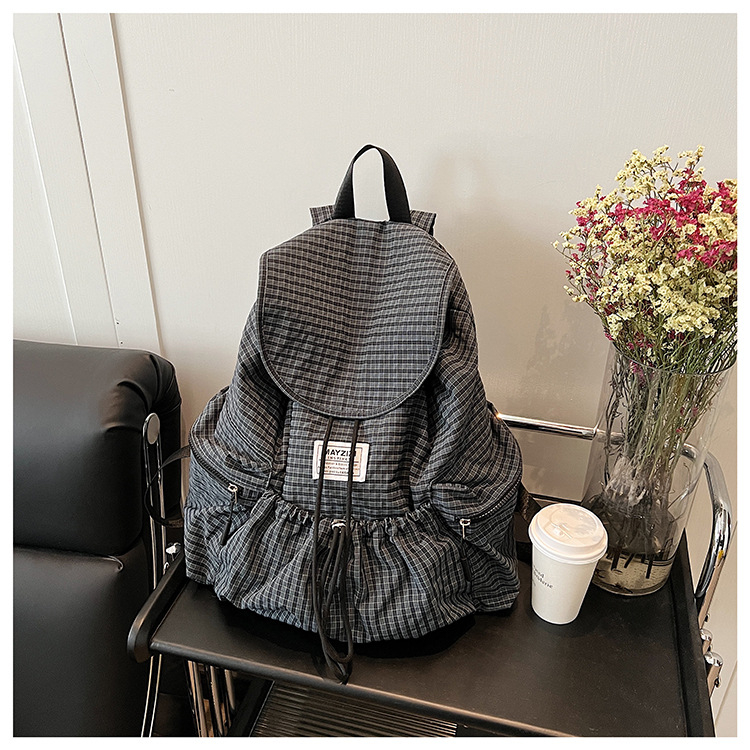 Ruksak velike kapacitete u urbanom minimalističkom stilu, korejski karirani uzorak, zatvarač na vrpce, laminirana unutarnja džep sa zipom, poliester podstava