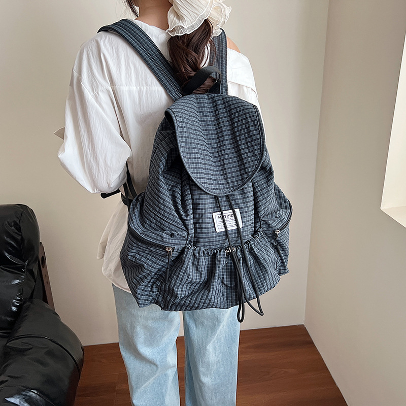 Ruksak velike kapacitete u urbanom minimalističkom stilu, korejski karirani uzorak, zatvarač na vrpce, laminirana unutarnja džep sa zipom, poliester podstava