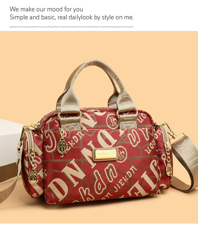 Női vízálló Oxford anyagú táska, kompakt négyszöges alak, cipzáras nyitás, belső zsebek (telefon, ID), poliészter bélés