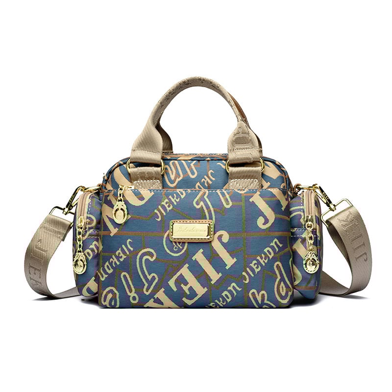 Női vízálló Oxford anyagú táska, kompakt négyszöges alak, cipzáras nyitás, belső zsebek (telefon, ID), poliészter bélés