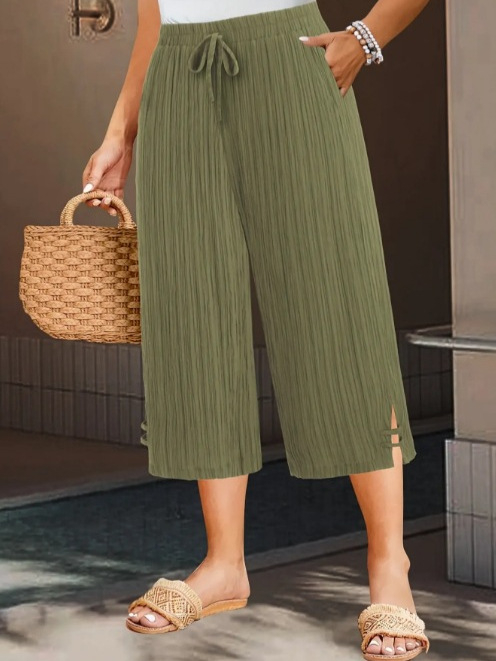 Ženske cropped hlače ravnog kroja od poliestera, s mikroelastičnim pojasom i džepovima