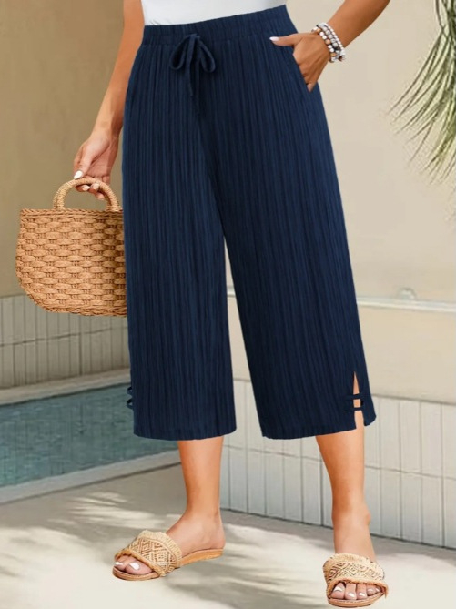 Ženske cropped hlače ravnog kroja od poliestera, s mikroelastičnim pojasom i džepovima