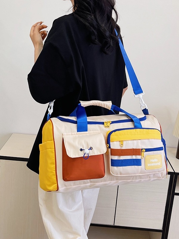 Putna torba s odjeljkom za suho/mokro i odvojenim pretincem za cipele; najlon, kapacitet 20–35 L, zatvaranje na zip.