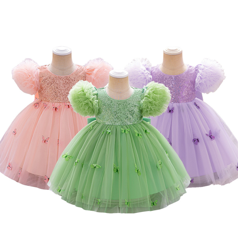 Dječja haljina princeza s aplikacijom leptira i mrežastim tilom; vjenčana haljina djeveruše; glavni materijal: poliester 65%, podstava pamuk 35%; Tehnologija tkanine: plisiranje, premaz, rezanje, enzimsko pranje; Ljeto 2025