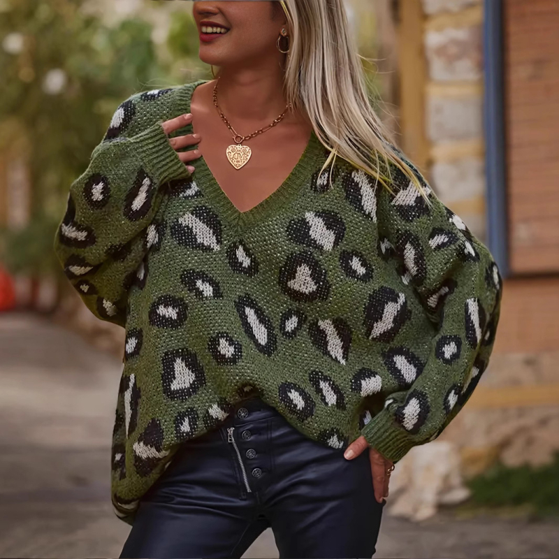 Džemper od viskoznog vlakna s geometrijskim uzorkom, ležernog kroja, V-izreza, dugim rukavima.