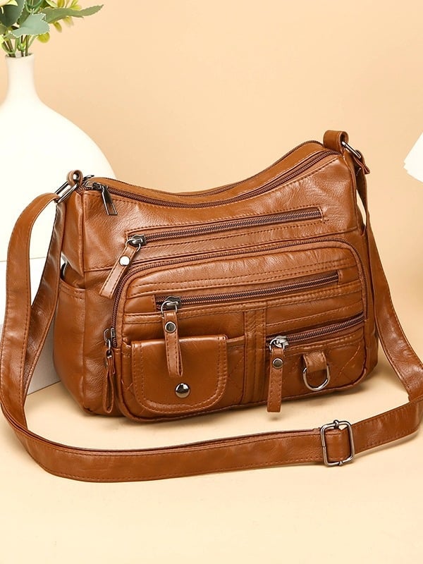 Torba za rame od meke PU kože, mali kvadratni oblik, zatvarač, unutarnji džep sa zipom i džep za telefon, podstava od poliester, jedna naramenica