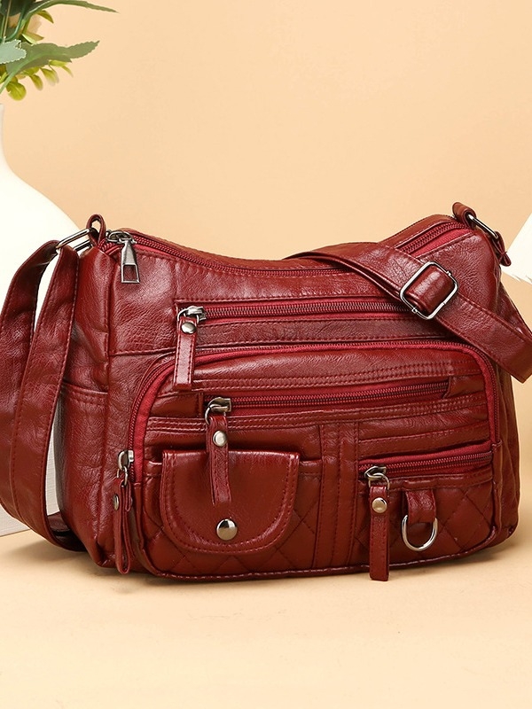 Torba za rame od meke PU kože, mali kvadratni oblik, zatvarač, unutarnji džep sa zipom i džep za telefon, podstava od poliester, jedna naramenica