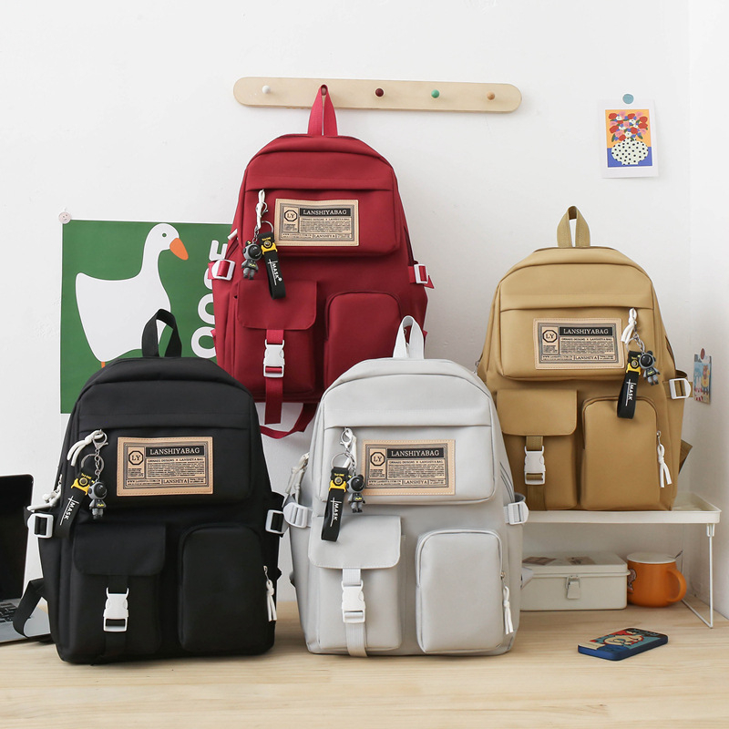 Unisex nylonový batoh s dizajnom v študentskom štýle, veľká kapacita, nepremokavý, zakrivený ramenný popruh, polyesterová podšívka, vzor s písmenami, mestský štýl