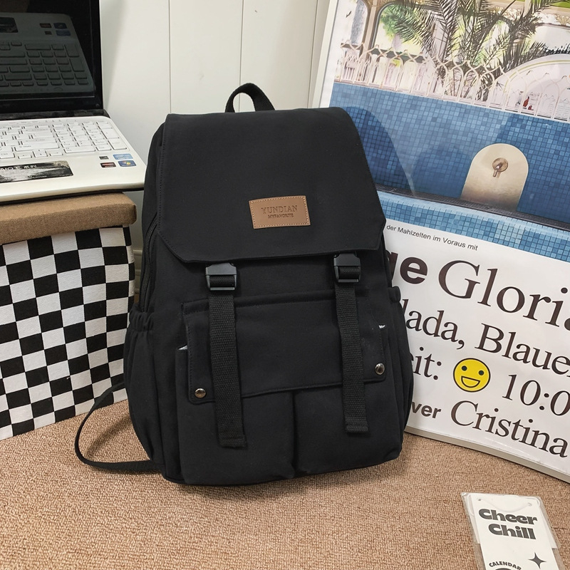 Unisex školski ruksak s preklopnim poklopcem, velika zapremina, nylon materijal, pogodan za rekreacijska putovanja.