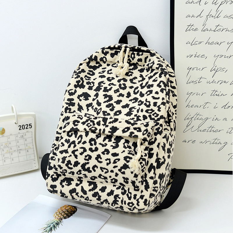 Унисекс раница с леопардов принт, Corduroy материал, 20–35L капацитет, подходяща за 12-инчов лаптоп, извита презрамка