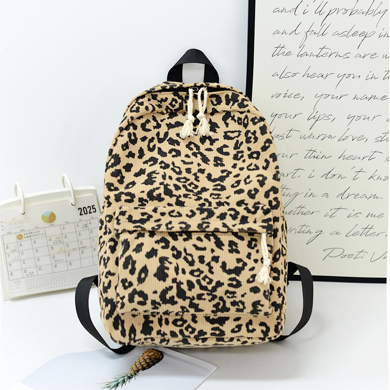 Унисекс раница с леопардов принт, Corduroy материал, 20–35L капацитет, подходяща за 12-инчов лаптоп, извита презрамка