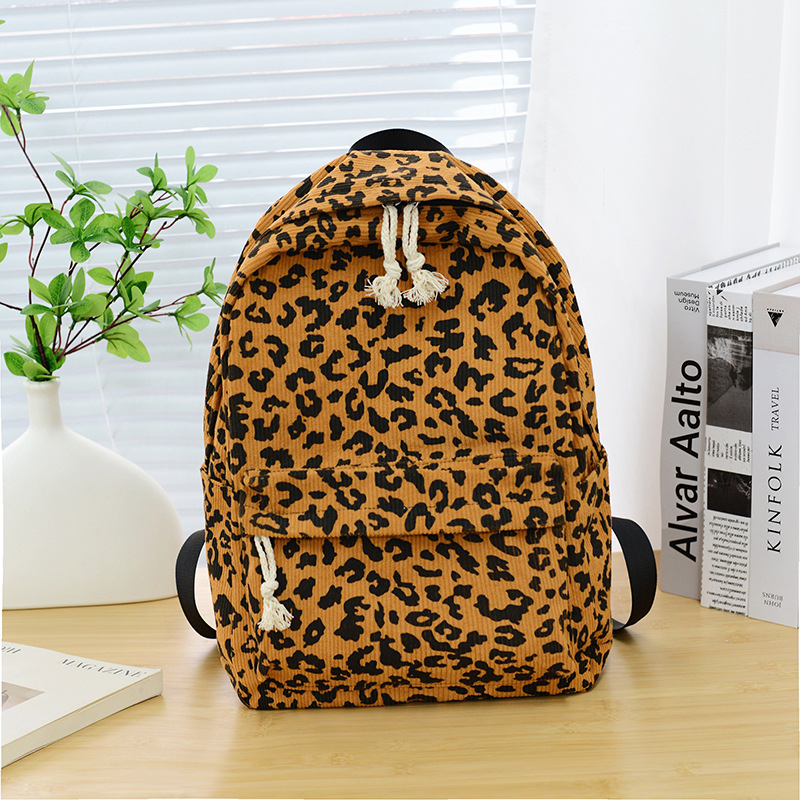 Унисекс раница с леопардов принт, Corduroy материал, 20–35L капацитет, подходяща за 12-инчов лаптоп, извита презрамка