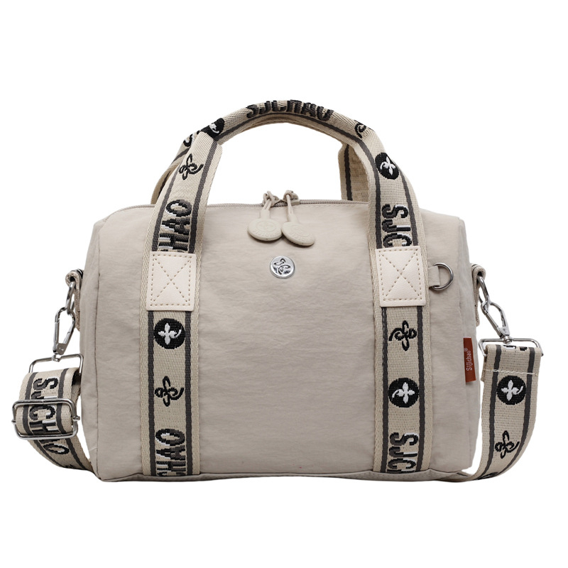 Torba preko ramena u obliku jastuka — gradski stil, najlon materijal, poliesterska podstava, zatvaranje na zip, unutarnja džep na zip