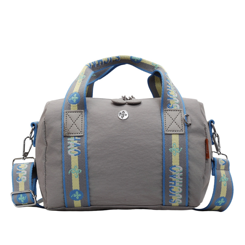 Torba preko ramena u obliku jastuka — gradski stil, najlon materijal, poliesterska podstava, zatvaranje na zip, unutarnja džep na zip