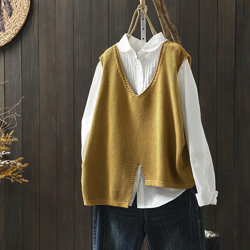 Adīta kokvilnas veste ar neregulāru maliņu, V–izgriezums, brīvs piegriezums, bez piedurknēm