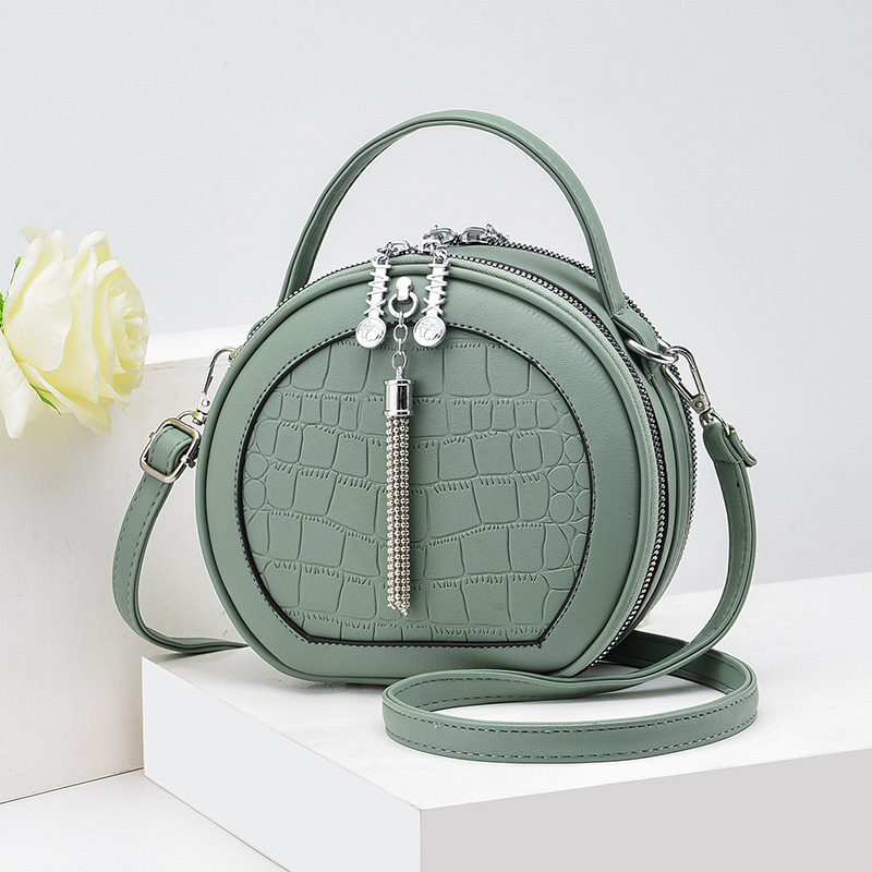 Crossbody τσάντα, μικρή κυκλική φόρμα, PU υλικό, φερμουάρ κλεισίματος, εσωτερική τσέπη με φερμουάρ, επένδυση πολυεστέρα