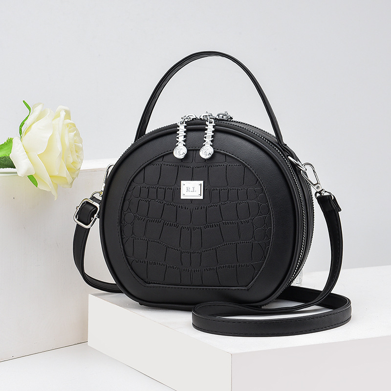 Crossbody taška, malý okrúhly tvar, PU materiál, zips otvorenie, vnútorná kapsa na zips, polyesterová výstelka