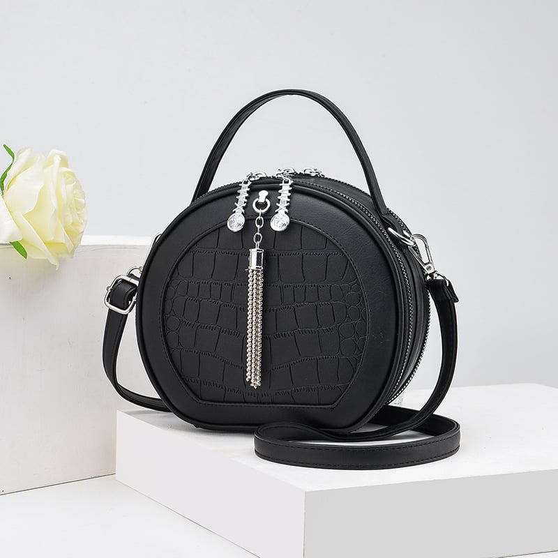 Crossbody taška, malý okrúhly tvar, PU materiál, zips otvorenie, vnútorná kapsa na zips, polyesterová výstelka