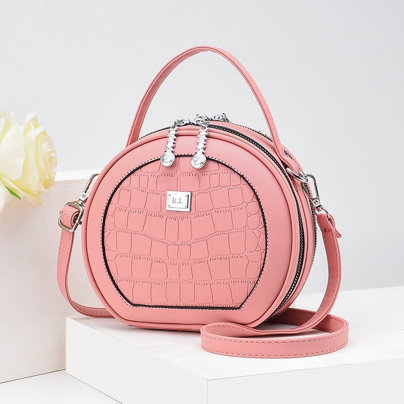 Crossbody taška, malý okrúhly tvar, PU materiál, zips otvorenie, vnútorná kapsa na zips, polyesterová výstelka