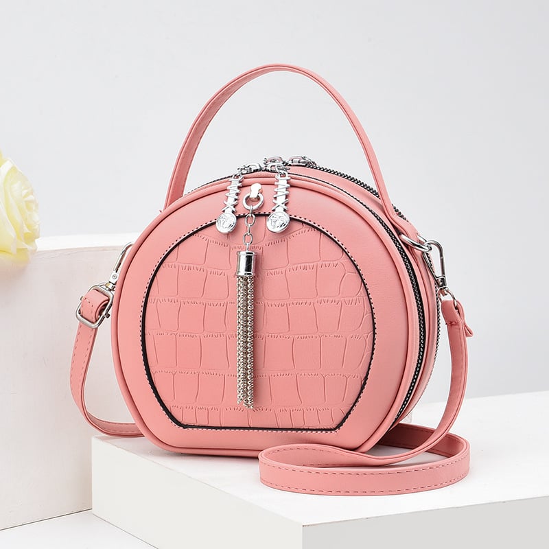 Crossbody taška, malý okrúhly tvar, PU materiál, zips otvorenie, vnútorná kapsa na zips, polyesterová výstelka