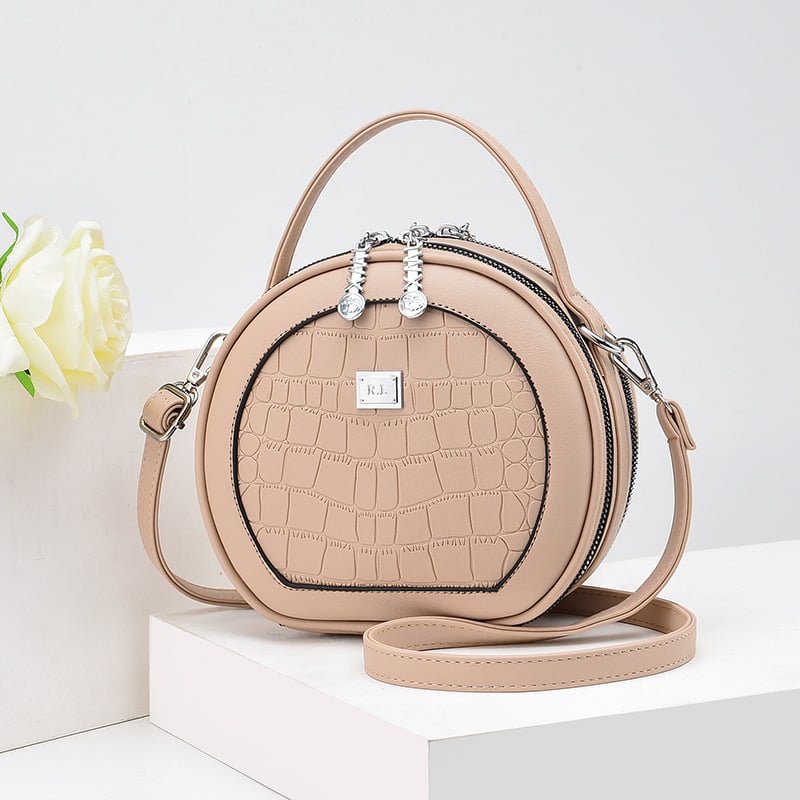 Crossbody taška, malý okrúhly tvar, PU materiál, zips otvorenie, vnútorná kapsa na zips, polyesterová výstelka