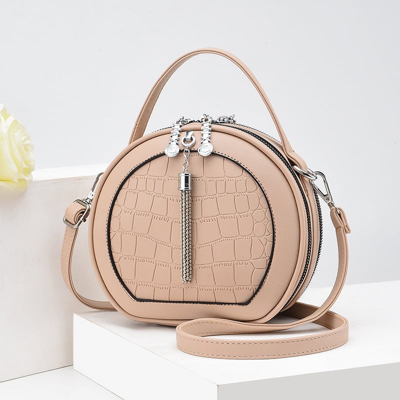 Crossbody taška, malý okrúhly tvar, PU materiál, zips otvorenie, vnútorná kapsa na zips, polyesterová výstelka