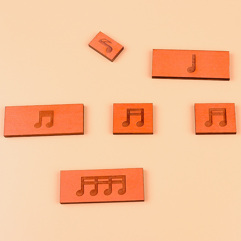 Drveni glazbeni puzzle – notе, ritam i glazbena teorija za početnike; ravni puzzle; materijal: građevinski blokovi; dobna skupina 15–35; kategorija: pravopisne ilustracije, ploče