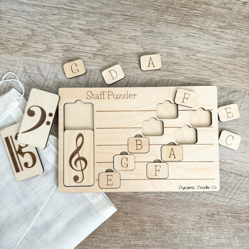 Medinė muzikos dėlionė vaikams – penkių takelių nata, ugdymo žaislas (Medžiaga: Boxwood; Medžiagos tipas: Mediena; Kategorija: Papuošalai; IP licencija: Nėra)