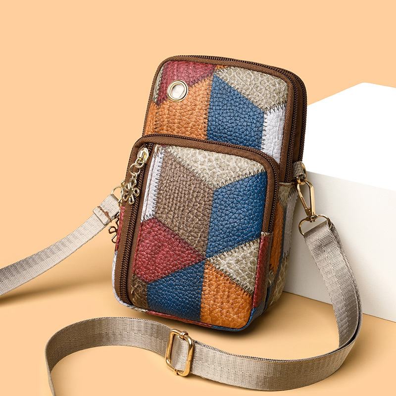 Crossbody telefon táska dupla cipzárral, PU anyagból, horizontálisan négyszögletes forma, belső telefonrekesz, egy vállpánt