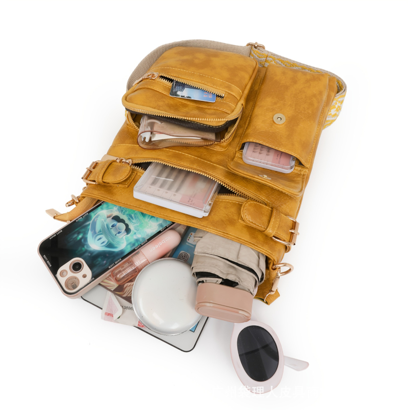 Női valódi bőrből készült váll- és keresztpántos táska, függőleges négyzetes formájú, cipzáras nyitás, belső cipzáras zseb, tehénbőr belső bélés, egyszeres vállpánt, 2025 nyár kiadás