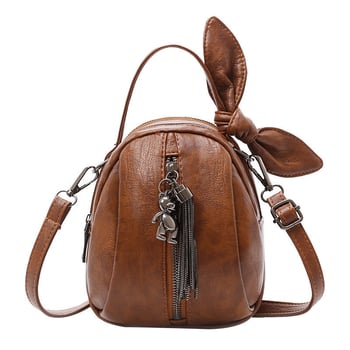 Mini PU crossbody torba, oblik kante, zatvarač, najlonska podstava i unutarnji sloj.