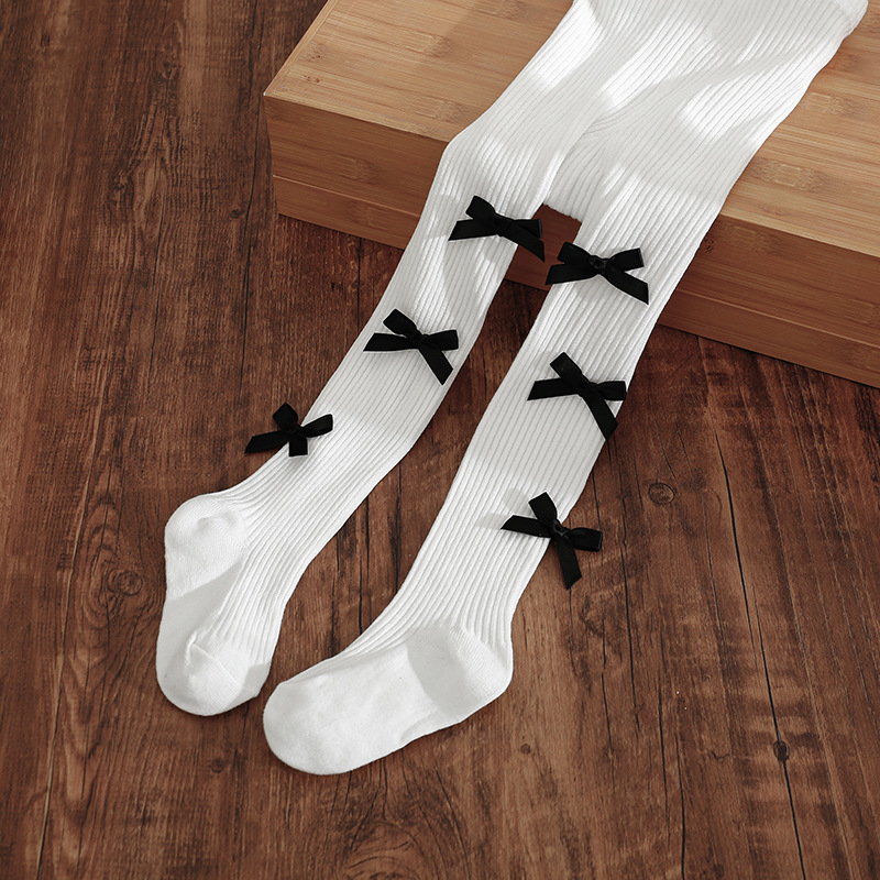 Vaikų kojinės su kojomis ir kaspinėliu, aukštas liemuo, elastinės, 83% medvilnė, kvėpuojančios ir prakaitą sugeriančios, storintos, 1–3 metų amžiaus, pavasaris–ruduo