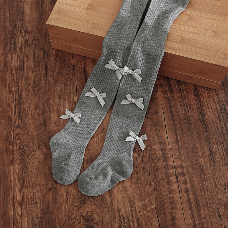 Vaikų kojinės su kojomis ir kaspinėliu, aukštas liemuo, elastinės, 83% medvilnė, kvėpuojančios ir prakaitą sugeriančios, storintos, 1–3 metų amžiaus, pavasaris–ruduo