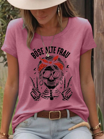 Γυναικείο T‑shirt με εκτύπωση κρανίου, μείγμα πολυεστέρα-βαμβάκι (50–70% πολυεστέρα, 30–50% βαμβάκι), κοντά μανίκια, στρογγυλή λαιμόκοψη, μεσαίο μήκος.