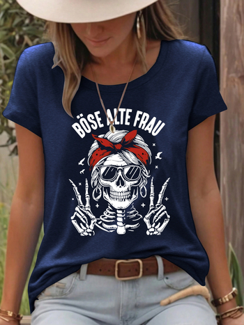 Γυναικείο T‑shirt με εκτύπωση κρανίου, μείγμα πολυεστέρα-βαμβάκι (50–70% πολυεστέρα, 30–50% βαμβάκι), κοντά μανίκια, στρογγυλή λαιμόκοψη, μεσαίο μήκος.