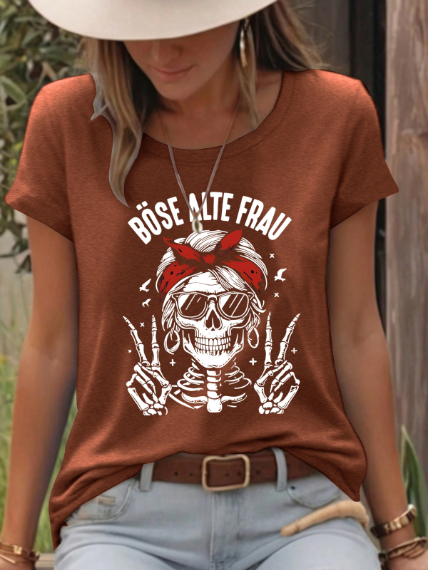 Moterų marškinėliai su kaukolės spauda, poliesterio–medvilnės mišinys (50–70% poliesterio, 30–50% medvilnės), trumpomis rankovėmis, apvalus kaklo iškirptė, vidutinio ilgio.