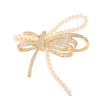 Χαλκός φιόγκος σε σχήμα καρφί με μικροεντοιχισμένα ζιρκόν και μαργαριτάρια, κομψή ελαφριά πολυτέλεια, Καλοκαίρι 2025