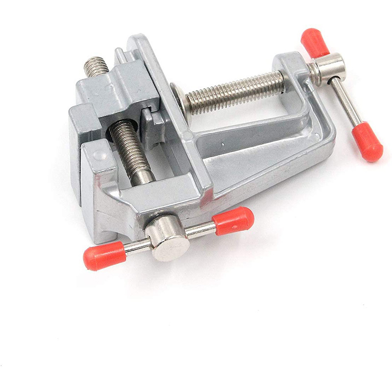 Mini universalus stalinis spaustukas su įrankio plieninėmis žnyplėmis, plastikinis rankena, sveria 153 g