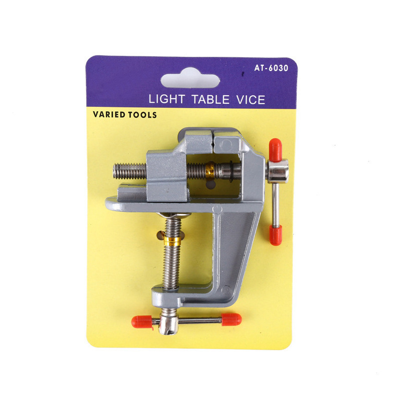 Mini universalus stalinis spaustukas su įrankio plieninėmis žnyplėmis, plastikinis rankena, sveria 153 g