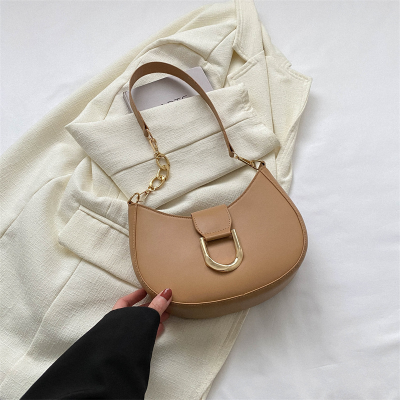 PU anyagú válltáska gombóc alakú dizájnal, poliészter bélés, cipzáras zárás, utcai trend